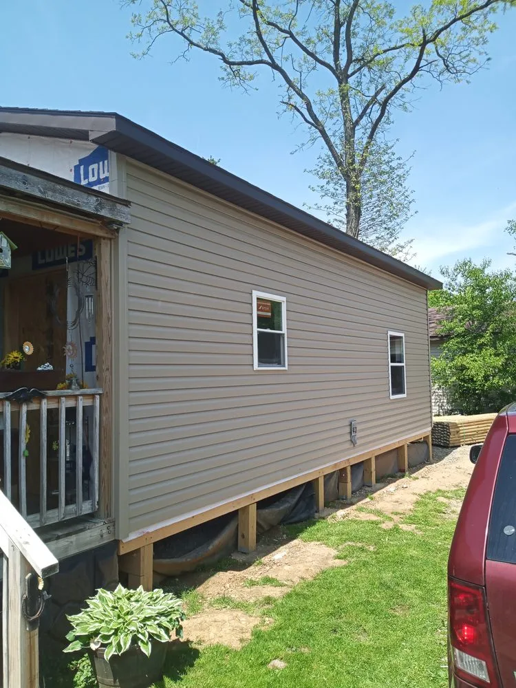 Custom lawn mowing service for outdoor upgrades in Uniontown, PA by JWL Renovations