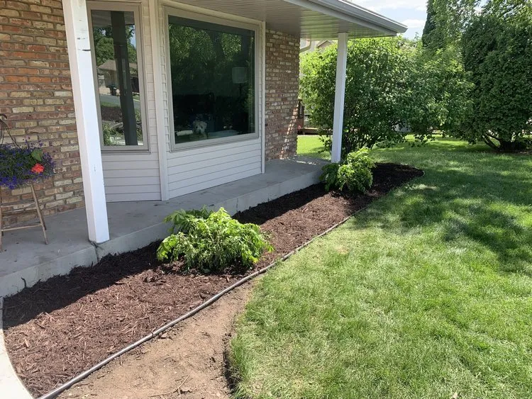 Custom outdoor landscaping with custom design in White Bear Lake, MN by K & B Solutions