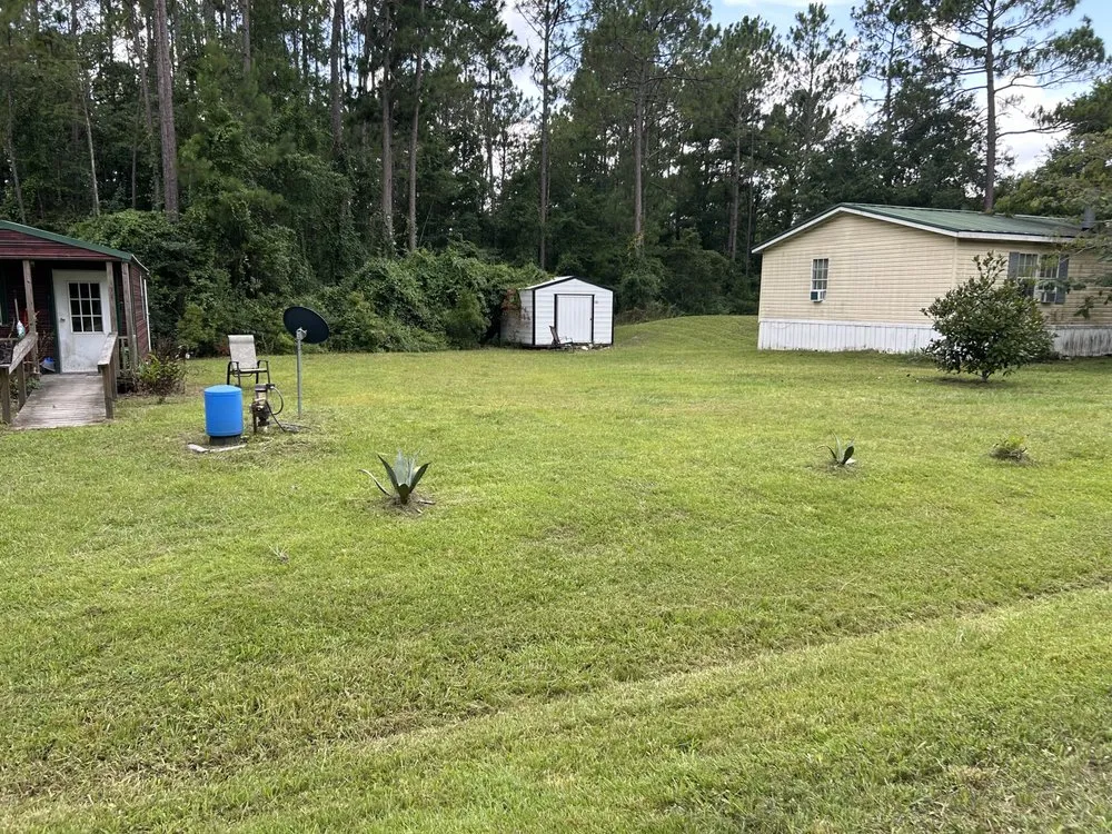 Professional lawn mowing service experts serving Middleburg, FL - K & H Property Management