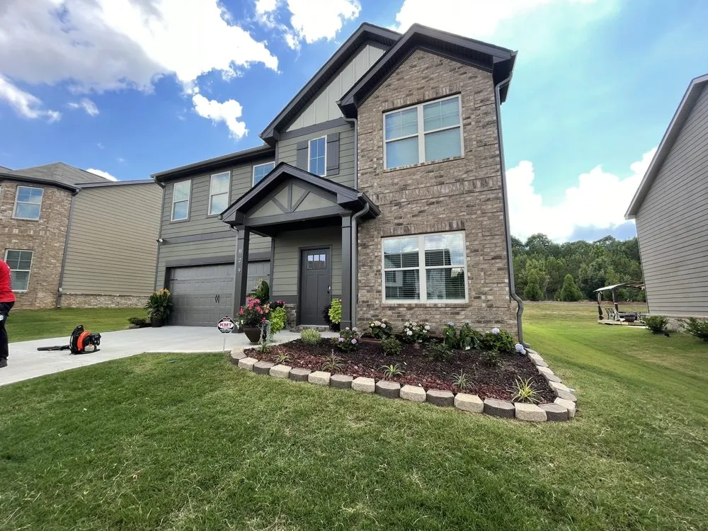 Custom lawn mowing service for residential properties in McDonough, GA by K and K Kreative Designes