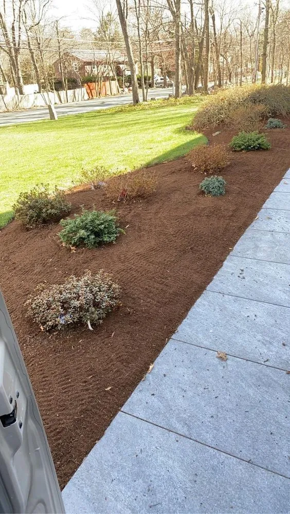 Professional yard maintenance for residential properties in Sharon, MA by Kahn Landscaping