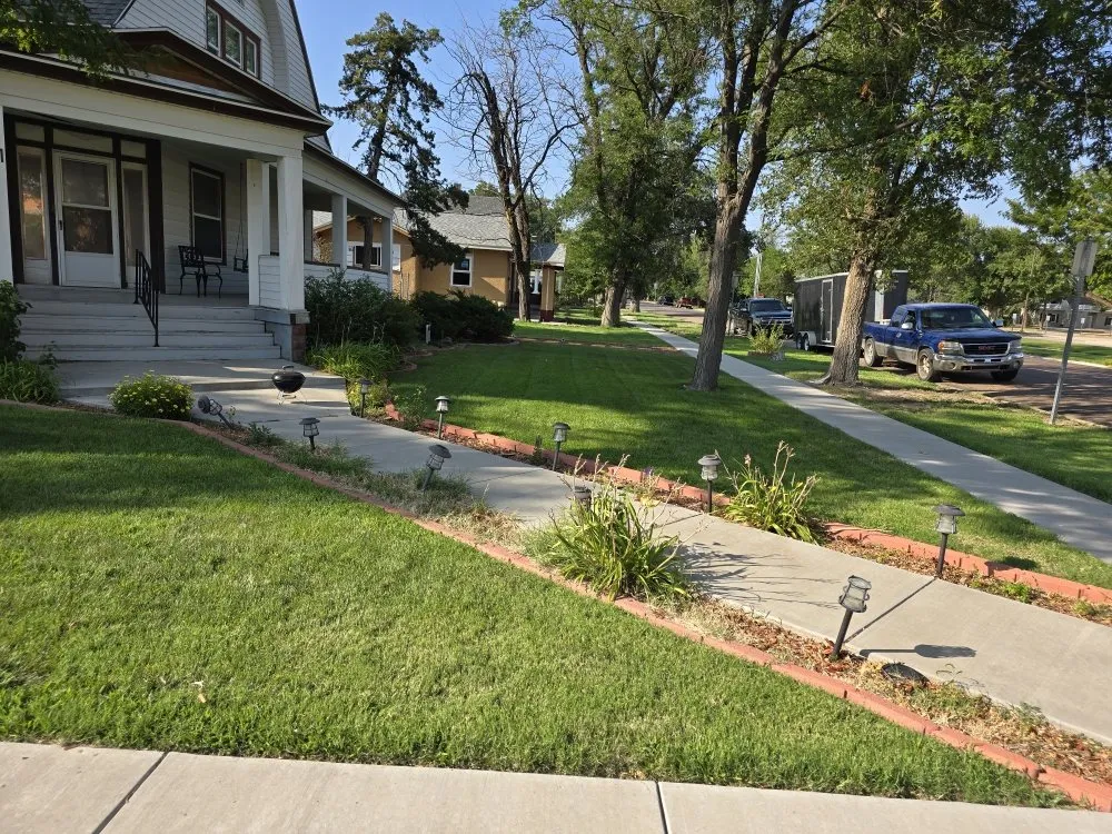 Affordable landscape installation with custom design in Garden City, KS by Kansas Lawns