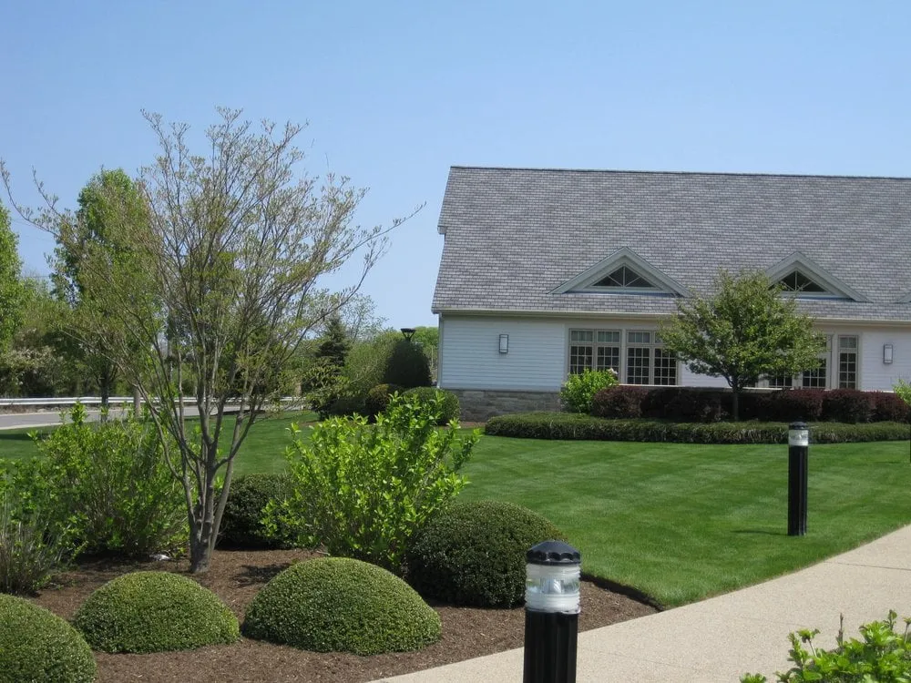 Professional lawn care service for year-round maintenance across Scituate, MA - Kelleher & Co Landscape Design