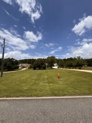 Kennedy’s Pristine Landscaping Services Logo