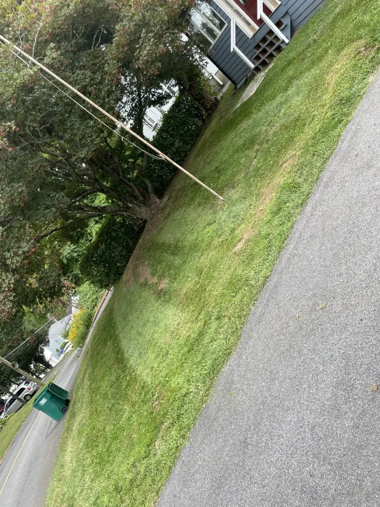 Professional lawn mowing service for homes in Ridgefield, CT by Kenney’s Landscaping