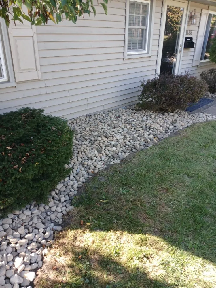Custom landscape installation for year-round maintenance in Warren, OH by Kens Landscaping And Junk Removal