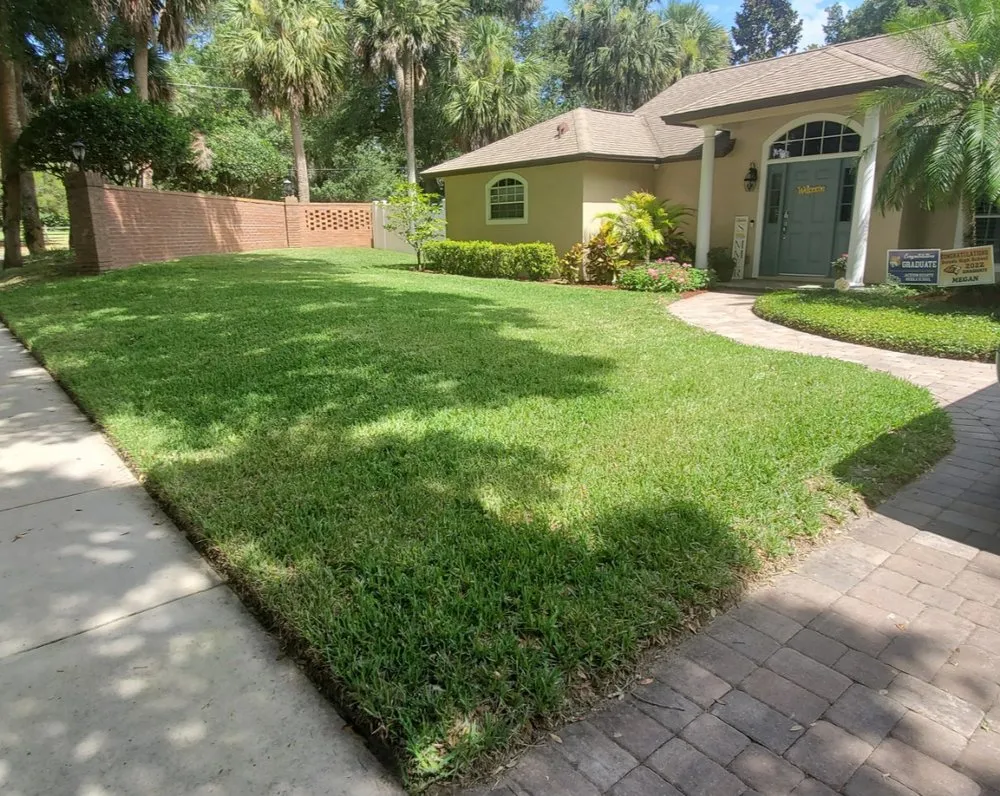 Professional lawn mowing service for residential properties in Oviedo, FL by Kimber Landscapes