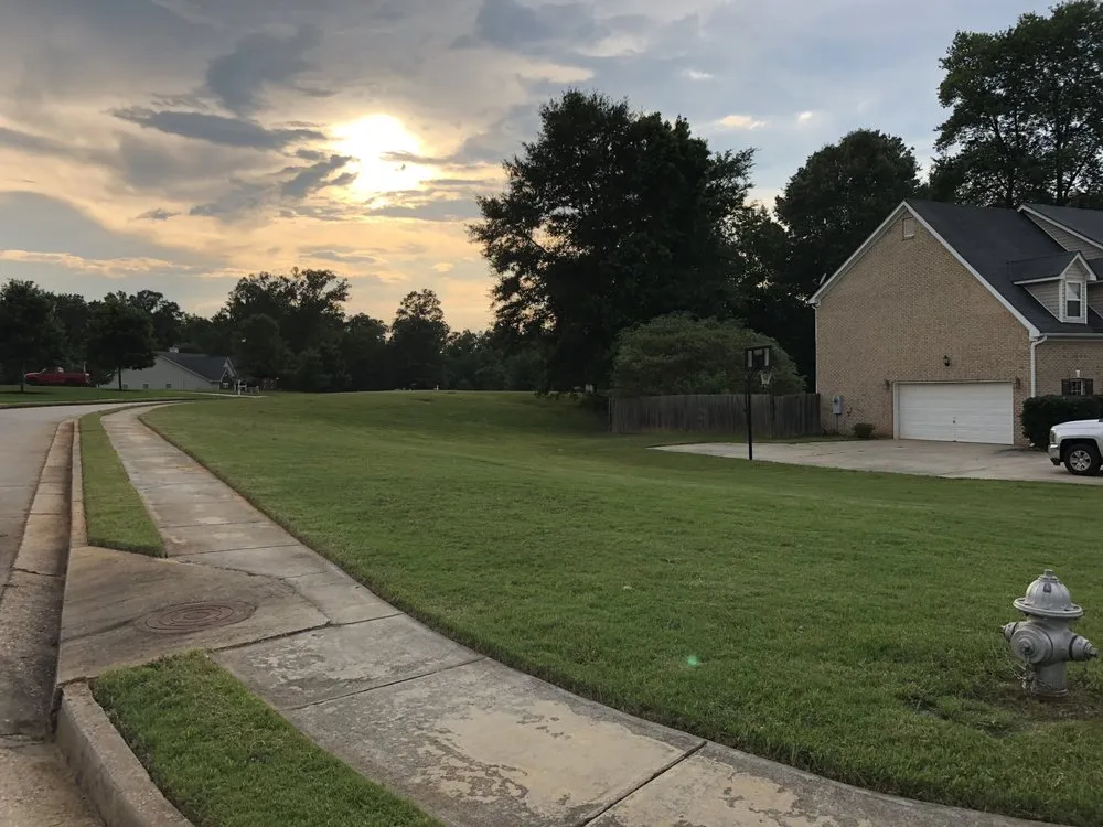 Affordable lawn mowing service for beautiful yards in Griffin, GA by Kirk's Cuts Landscaping and Lawn Maintenance