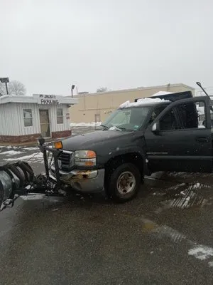 Kiss my Grass Landscaping and Plowing Logo