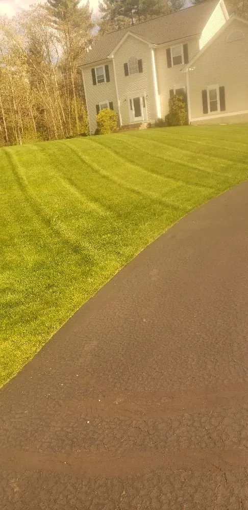 Expert lawn mowing service for homes across Uxbridge, MA - KJ Landscape Construction