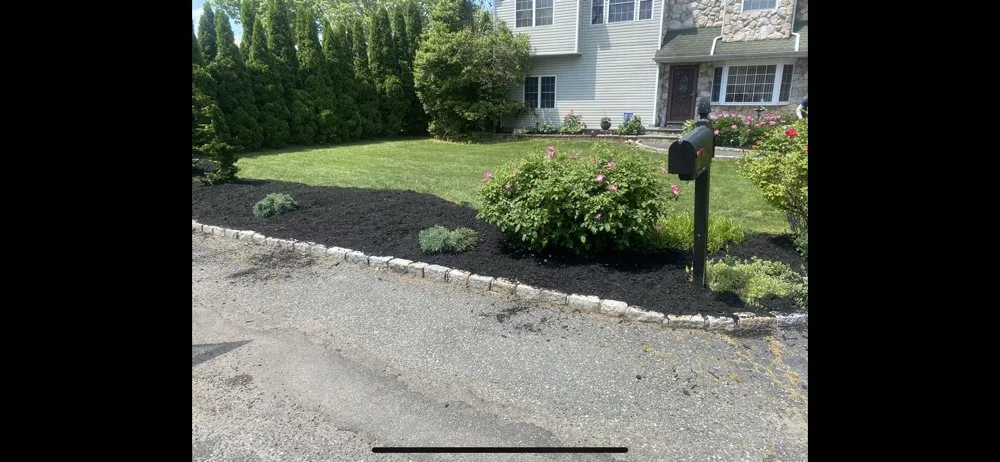 Affordable lawn mowing service with custom design in Bay Shore, NY by K&M Landscaping