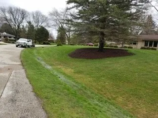 Expert yard maintenance for homes in Waukesha, WI by KNE Customs