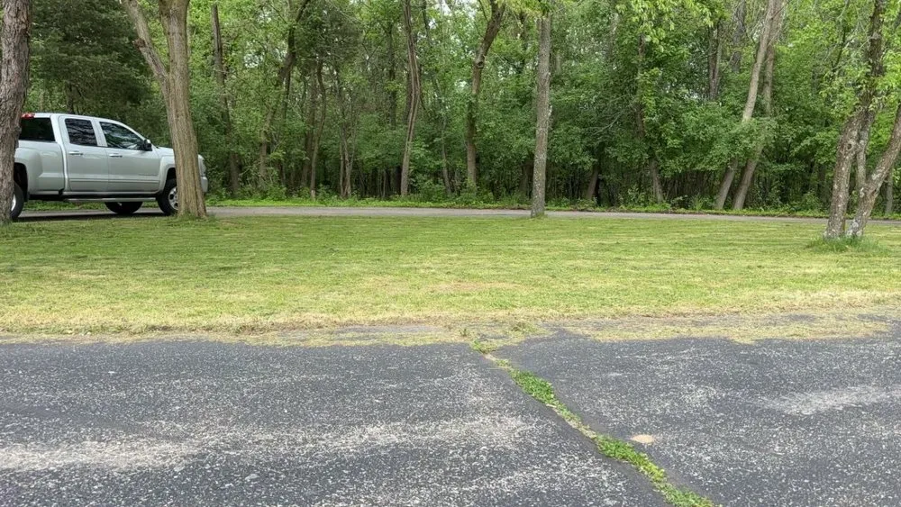 Affordable lawn care service for residential properties in Elkhorn, WI by KNK Landscaping Customs