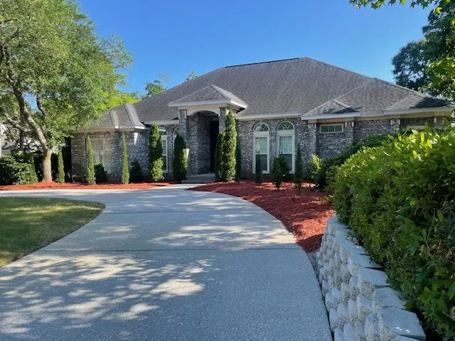 Custom yard cleanup service for beautiful yards in Surfside Beach, SC by Koch Garden Palms Landscaping