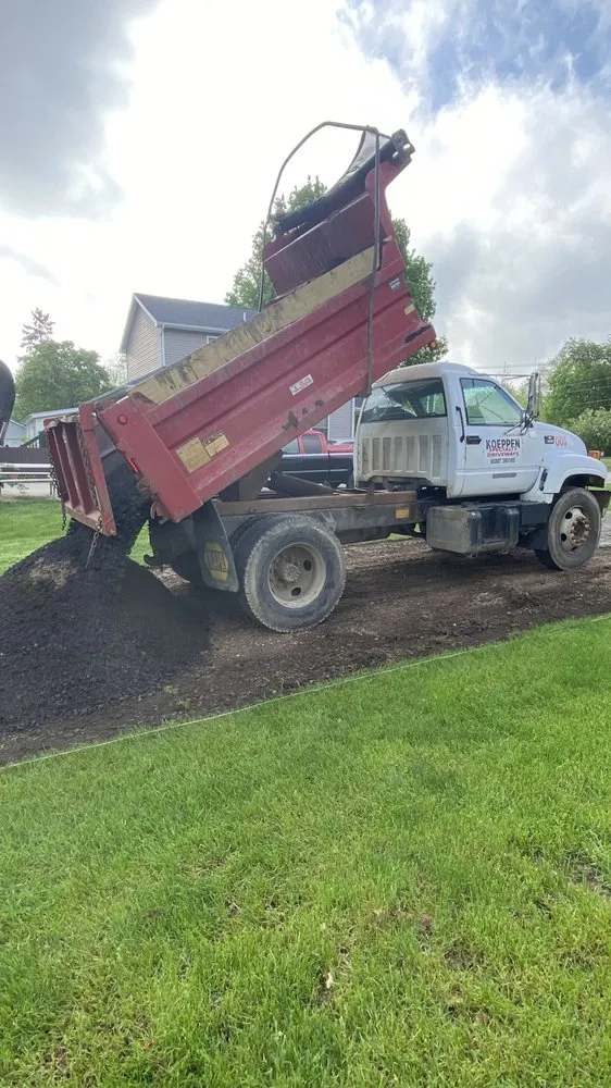 Professional lawn mowing service in Charlotte, MI by Koeppen Specialty Driveways