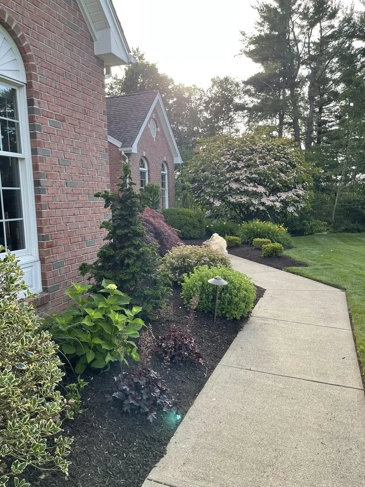 Custom lawn mowing service for outdoor upgrades in Ellington, CT by Kosilla Landscaping Services