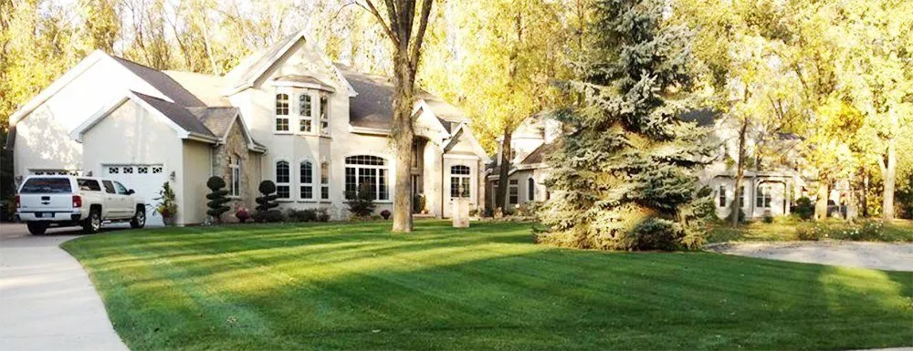 Custom lawn mowing service for year-round maintenance across New London, WI - Kuether Services