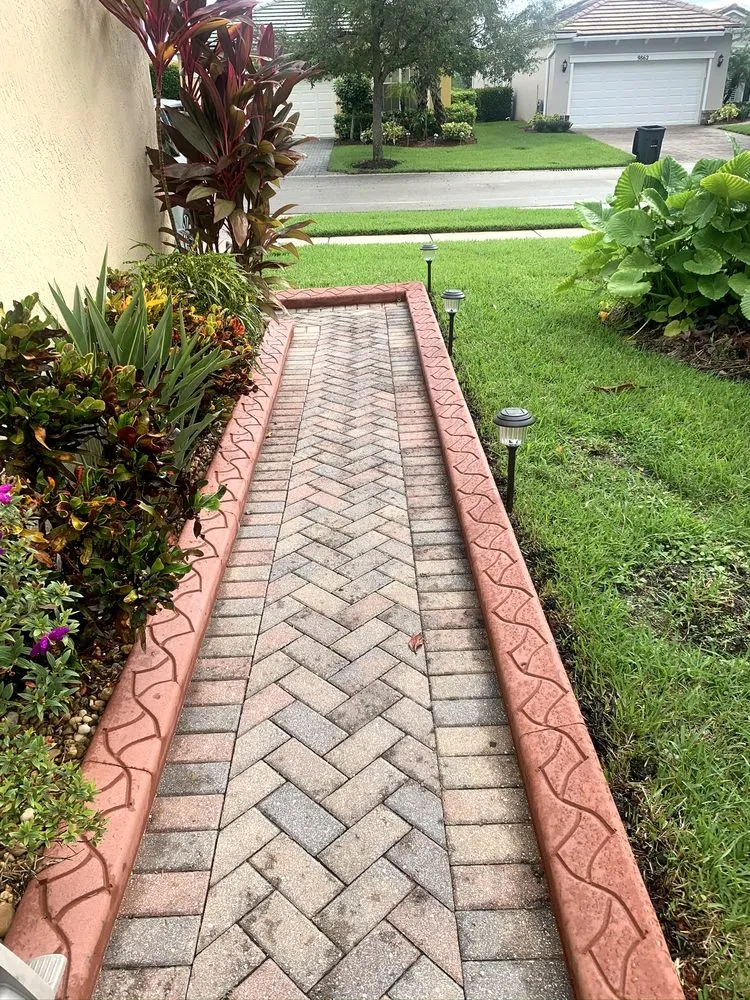 Trusted lawn mowing service for year-round maintenance in Fort Pierce, FL by Kurbing