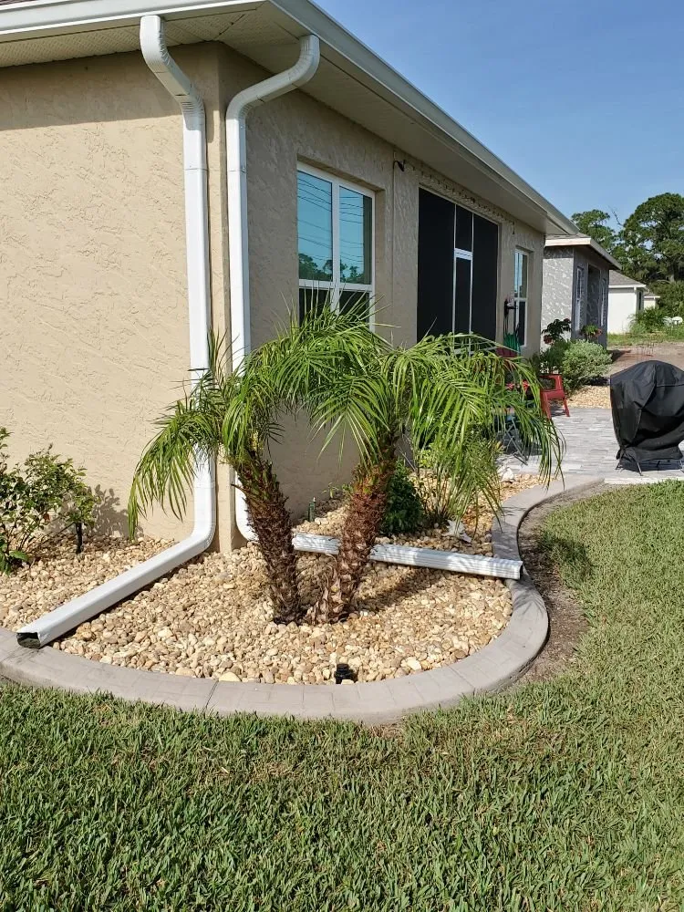 Affordable lawn mowing service for year-round maintenance in Port Charlotte, FL by Kustomized Kurbing