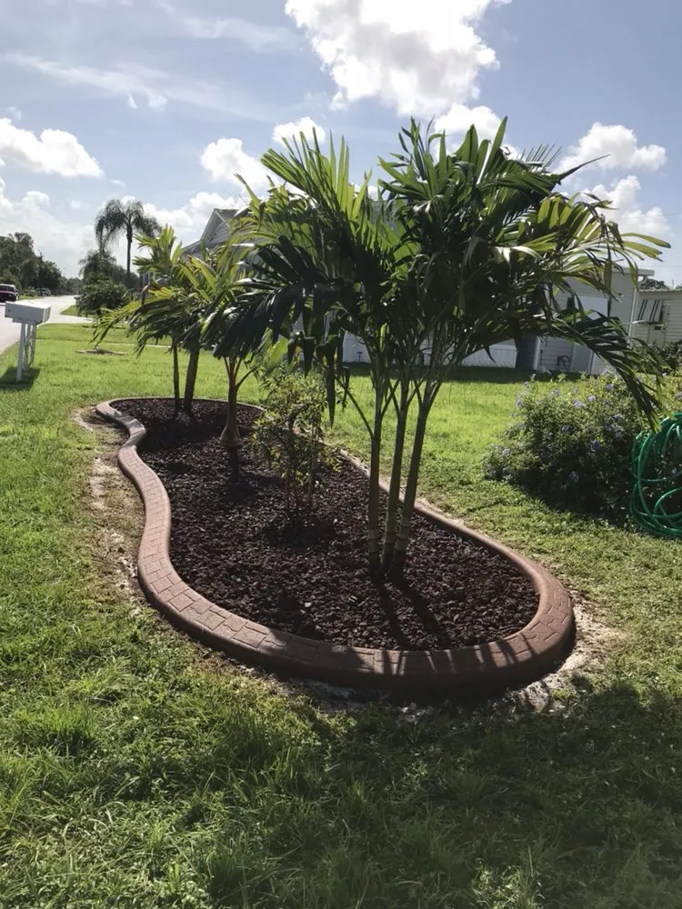 Expert lawn mowing service for homes in Cape Coral, FL by L J Decorating Landscape