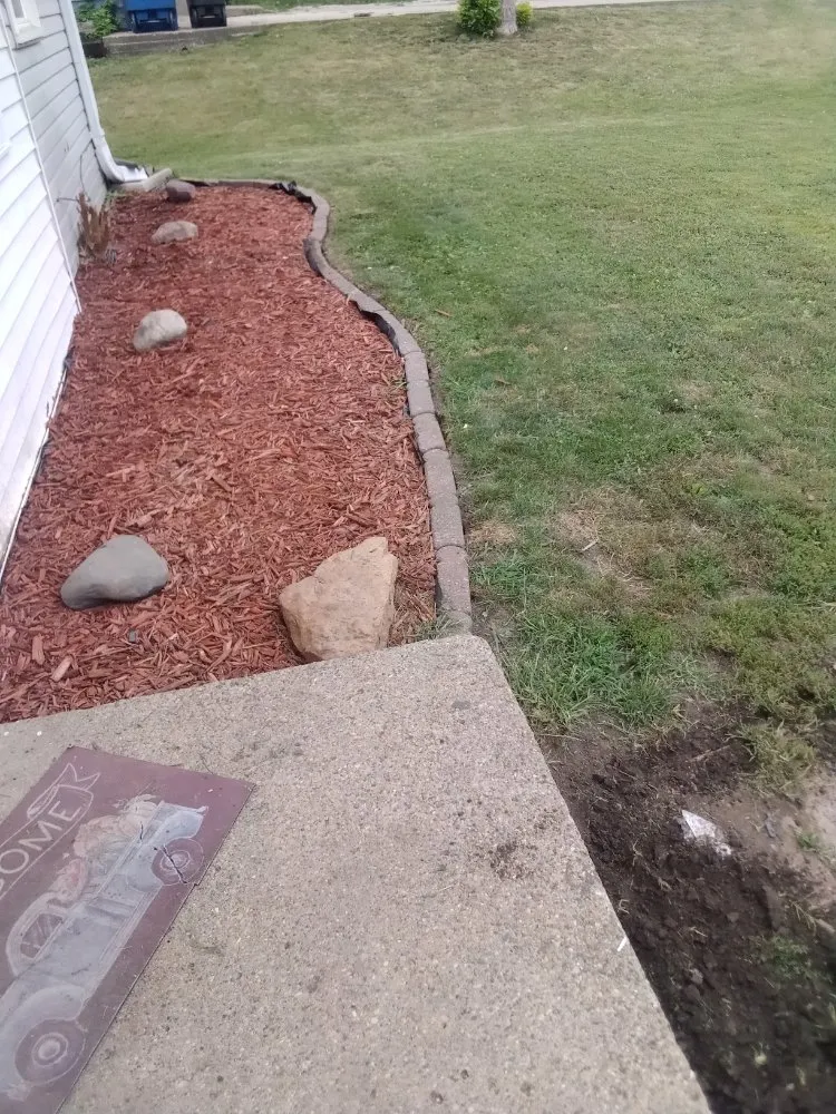 Custom lawn mowing service with custom design in Des Moines, IA by L N M Services