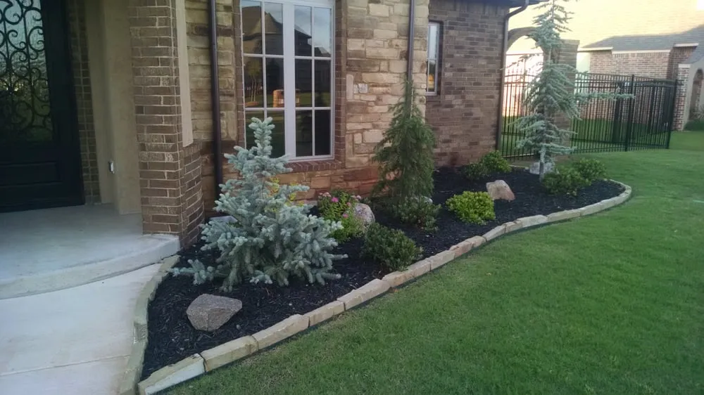 Affordable landscape design in Midwest City, OK by Ladan Lawnscapes