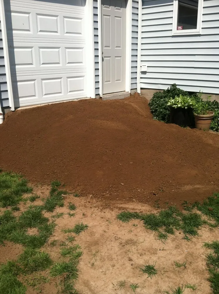 Custom garden landscaping for outdoor upgrades in Waterport, NY by Lakeshore Property Maintenance