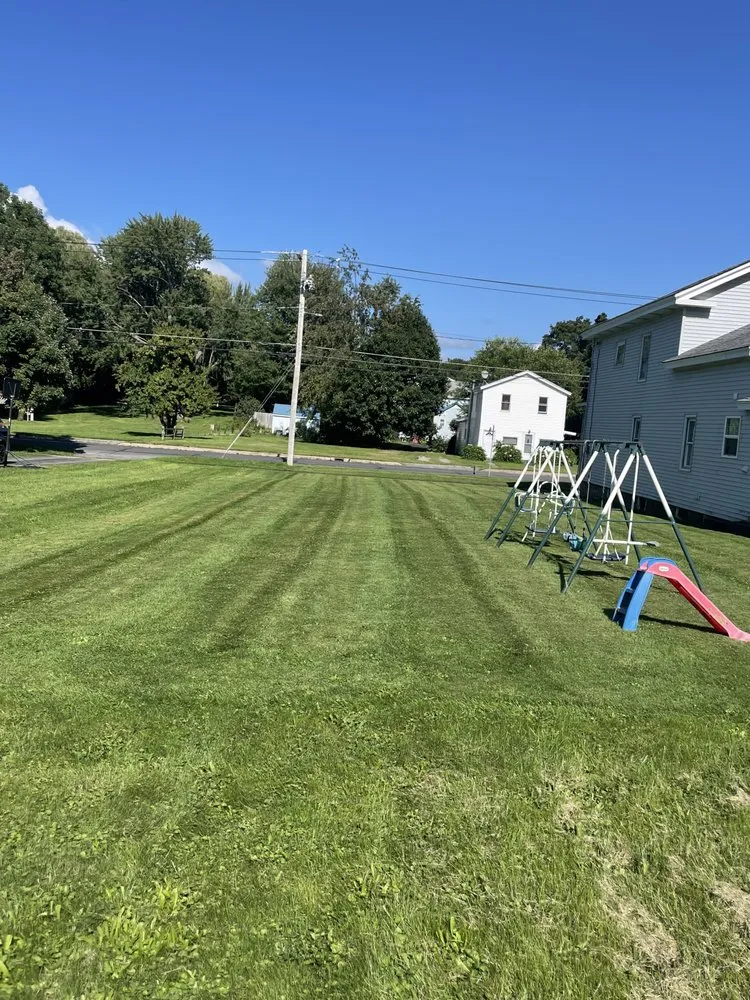 Expert lawn mowing service for year-round maintenance in Oswego, NY by Lakeside Landscapes