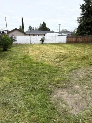 Lalo's Lawn & Fence Care Logo