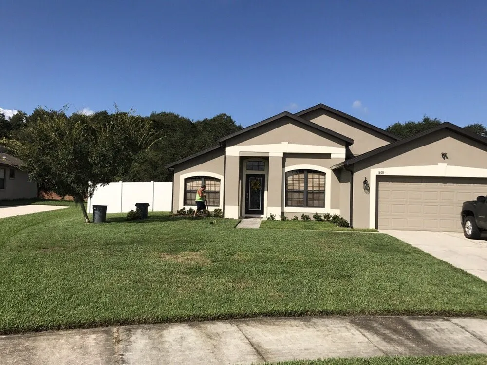 Custom landscape installation for year-round maintenance in Ocoee, FL by Lambert's Lawn Service