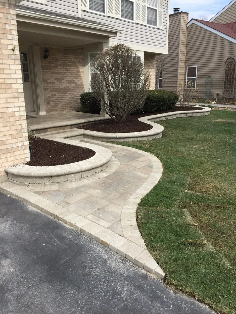 Professional yard maintenance for homes in Elgin, IL by Land and Lawn Services