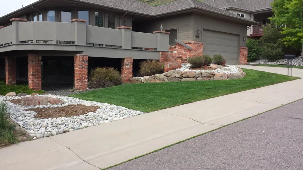 Reliable lawn care service for year-round maintenance in Denver, CO by Land of Green