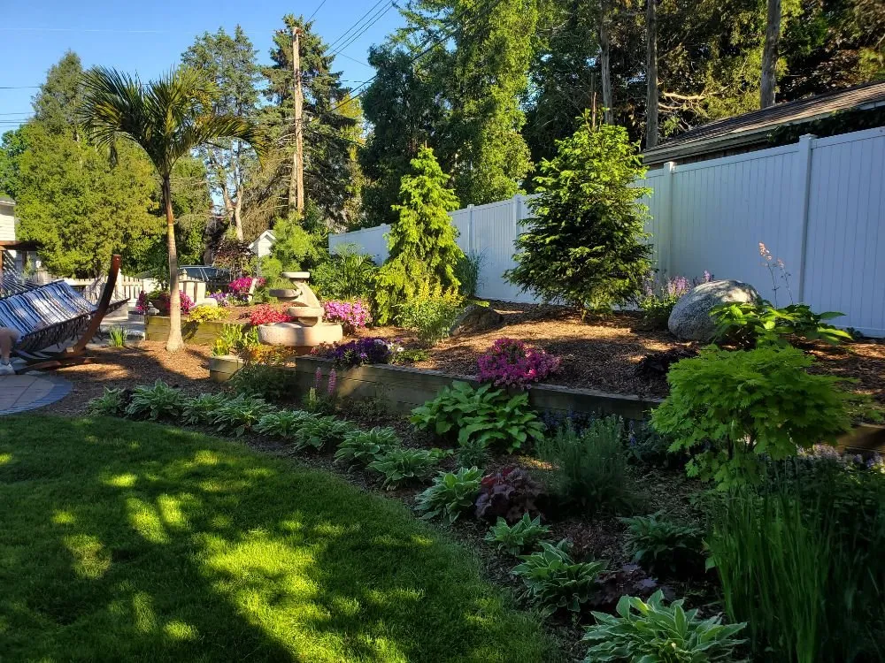 Custom garden landscaping for residential properties in Lansing, MI by Land Visions