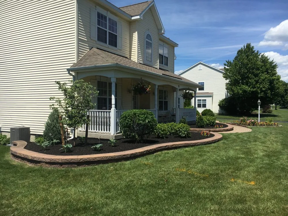 Custom lawn mowing service for residential properties in Glenville, NY by Landmark Design & Installation