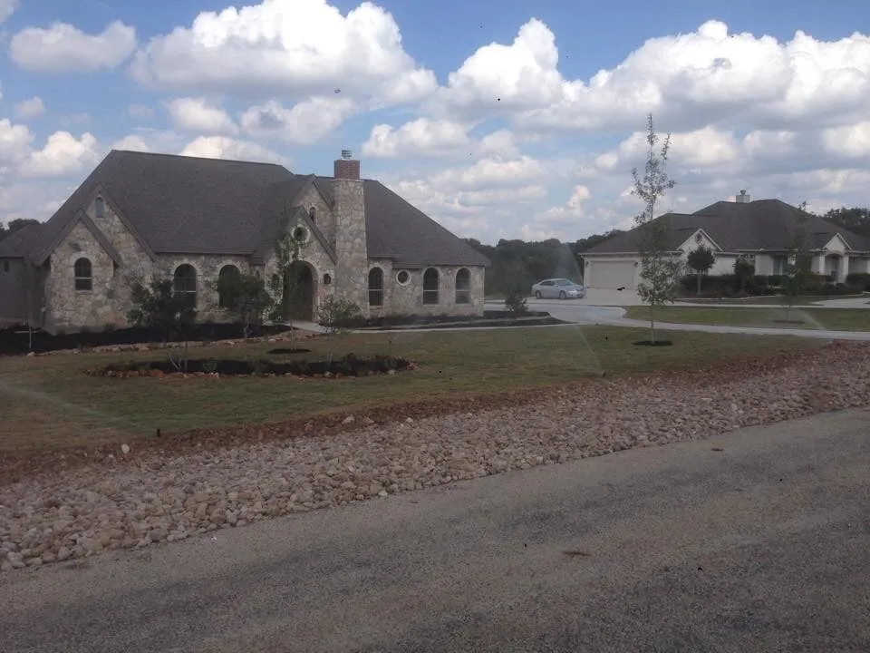 Affordable lawn care service with custom design in New Braunfels, TX by Landscape Commander