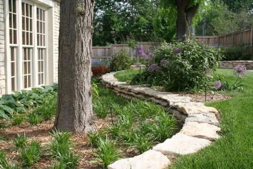 Custom landscape installation with custom design in New Cambria, KS by Landscape Consultants