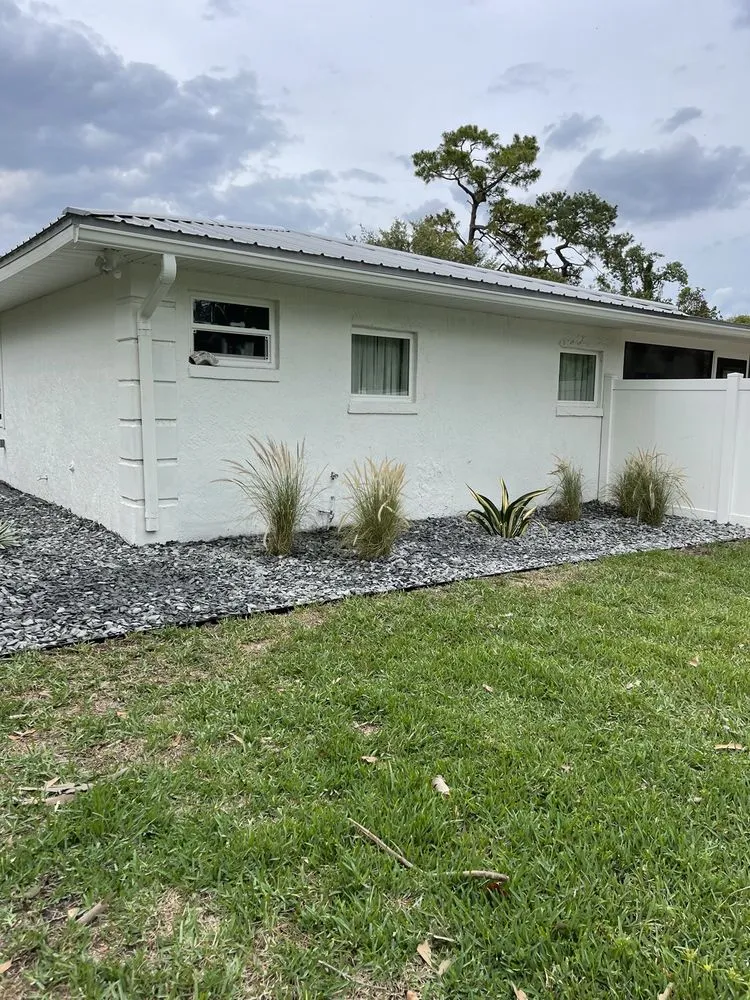 Local yard cleanup service for year-round maintenance in Orlando, FL by Landscape Improvements