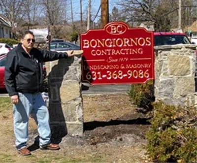 Custom outdoor landscaping in East Northport, NY by Landscape Masons