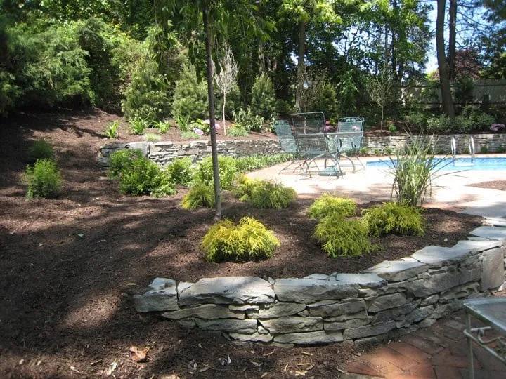 Local outdoor landscaping for year-round maintenance in East Northport, NY by Landscape Masons