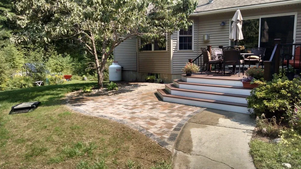 Custom outdoor landscaping with custom design in Goffstown, NH by Landscape Plus