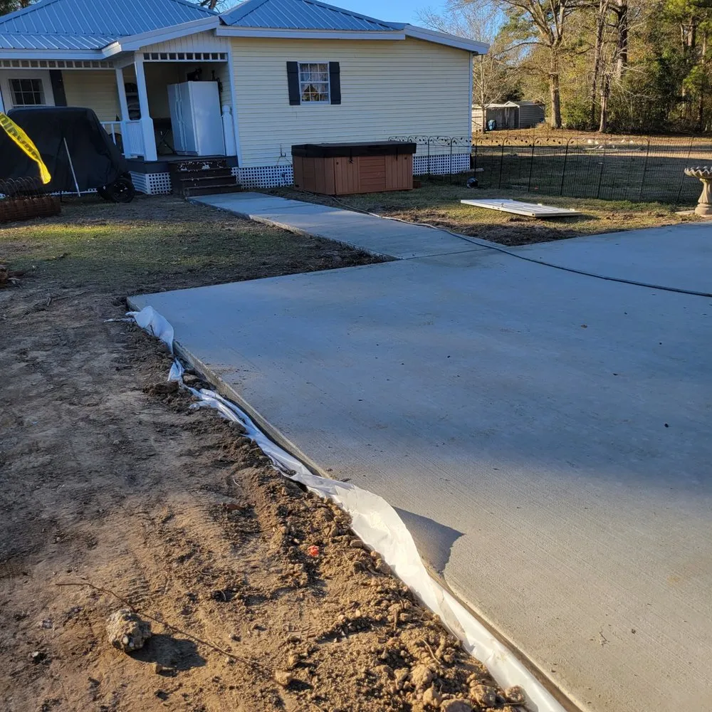 Local lawn mowing service in Saucier, MS by Landscaping & Concrete Solutions