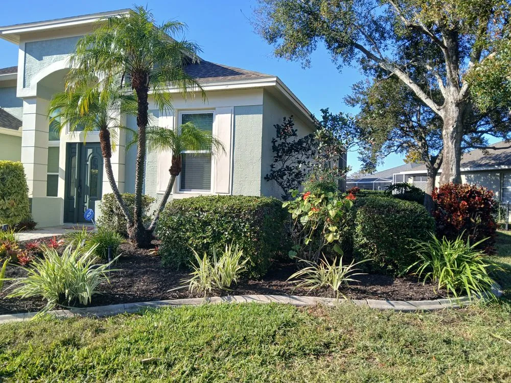 Professional landscape installation for year-round maintenance in Tampa, FL by Landscaping Heandscrafted Portillo