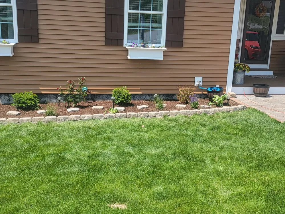 Custom outdoor landscaping for homes in Franklin, NH by Laramee's Lawn Care Services And Landscaping