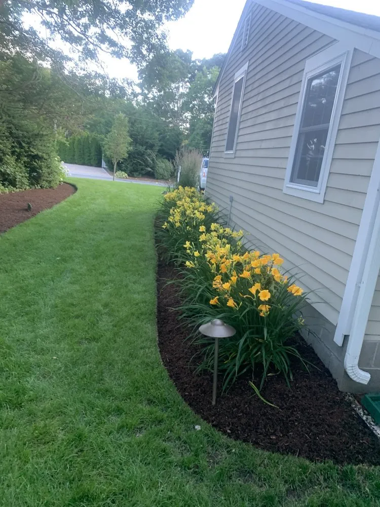 Custom landscape installation for year-round maintenance across Bourne, MA - Larrys Landscape