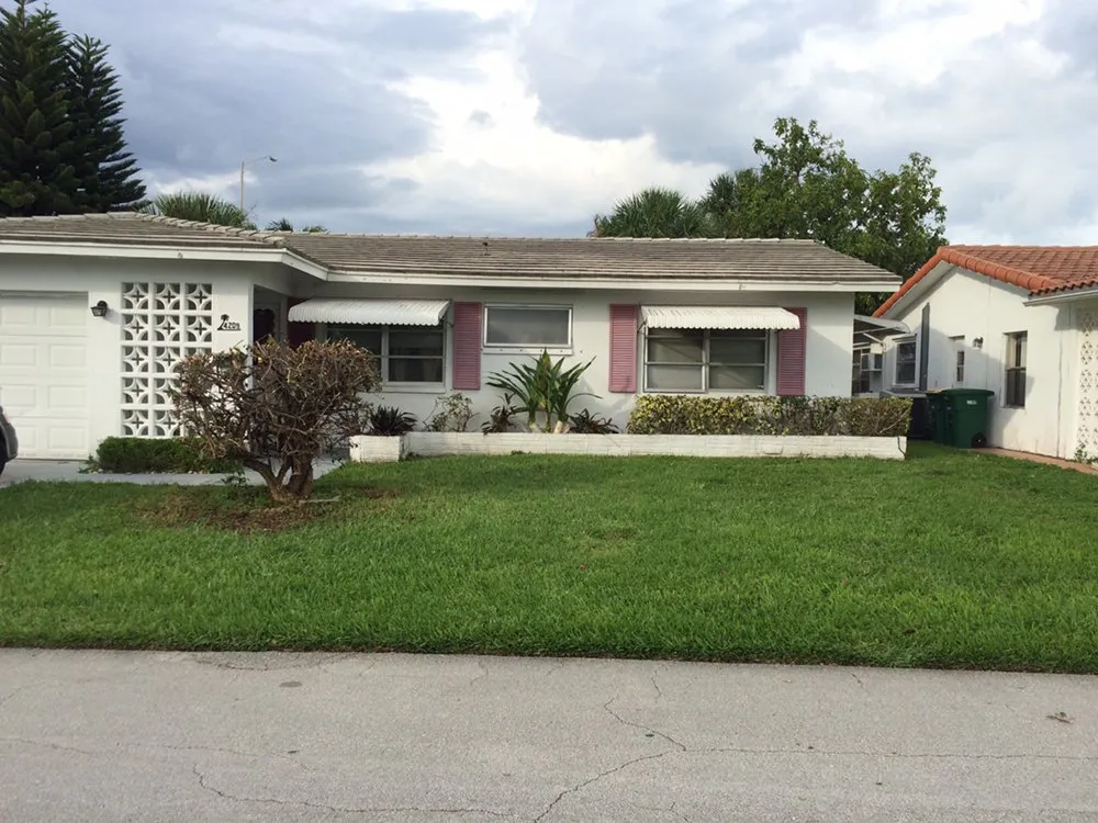 Reliable lawn mowing service with custom design in Tamarac, FL by Larsen Landscaping