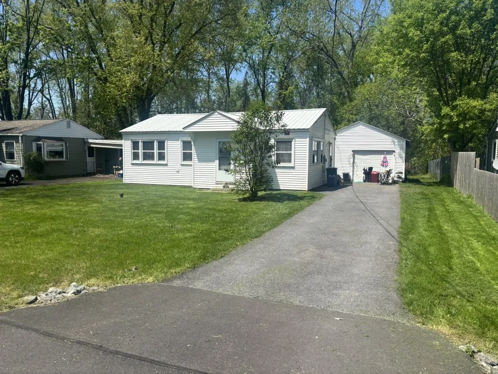 Trusted lawn mowing service for residential properties in Syracuse, NY by LaTray’s lawn care and property management