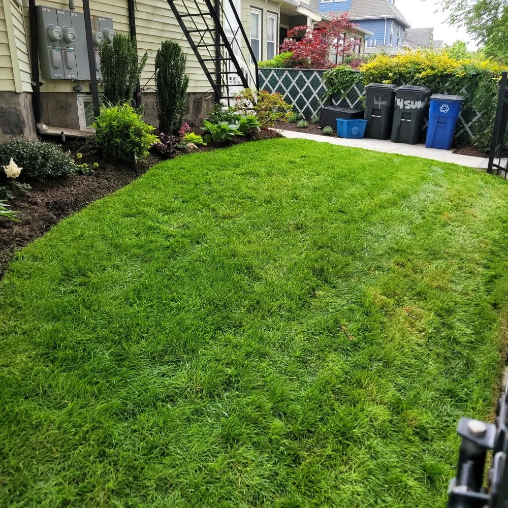 Custom landscape installation for outdoor upgrades across Boston, MA - Lawn & Beyond Organic Landscaping