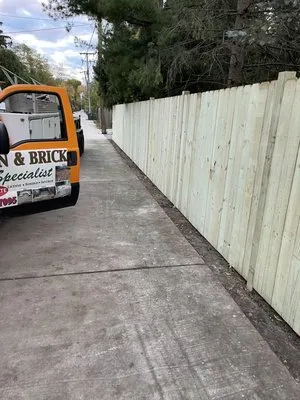 Lawn and Brick Landscaping Logo