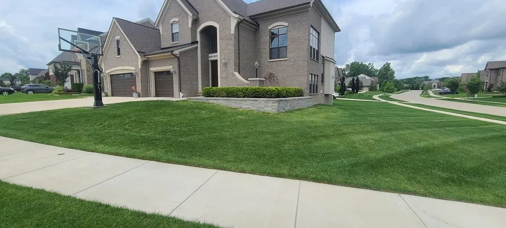 Custom landscape installation for year-round maintenance in Lake Orion, MI by Lawn and Landscaping Services