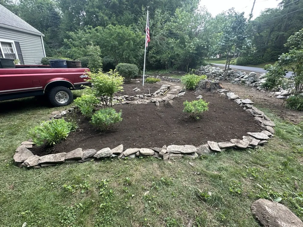 Professional landscape installation for year-round maintenance in Uxbridge, MA by Lawn and Order Landscaping